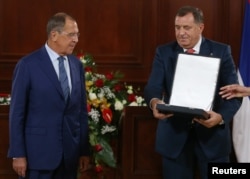 President of the Republika Srpska, Milorad Dodik awards Russia's Foreign Minister Sergei Lavrov with Order of the Republika Srpska, after their meeting in Banja Luka, Bosnia and Herzegovina, Sept. 21, 2018.