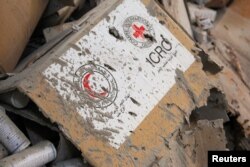 Damaged Red Cross and Red Crescent medical supplies lie inside a warehouse after an airstrike on the rebel held Urm al-Kubra town, western Aleppo city, Syria Sept. 20, 2016.