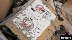 Damaged Red Cross and Red Crescent medical supplies lie inside a warehouse after an airstrike on the rebel held Urm al-Kubra town, western Aleppo, Syria Sept. 20, 2016.