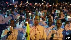 FILE - Catholic Bishops from different Indian states participate in a candle light vigil to protest attacks on churches in the Indian capital, as they assembled outside St. Antony's Church after attending the 27th Plenary Assembly of the Conference of Catholic Bishops of India in Bangalore, India, Feb. 6, 2015.