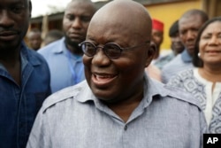 Nana Akufo-Addo, presidential candidate of the opposition New Patriotic Party, after casting his vote during the Presidential and parliamentary elections in Kibi, eastern Ghana, Dec. 7, 2016.