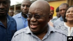 FILE - In his first 100 days in office, Nana Akufo-Addo, shown after casting his vote in Kibi in Ghana's elections Dec. 7, will be sending "a clear signal ... that he intends to run this country well," his spokesman says.