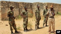 FILE - Ethiopian soldiers patrol in Baidoa, Somalia, Feb. 29, 2012, as part of the African Union peacekeeping mission known as ATMIS. In 2024, there is concern that tensions between Somalia and Ethiopia could lead to fighting between Ethiopian soldiers in Somalia and Somalis.