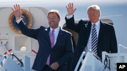 President Donald Trump arrives with Sen. Dean Heller, R-Nev., on Air Force One at Elko Regional Airport, Oct. 20, 2018, in Elko, Nev., for a campaign rally.