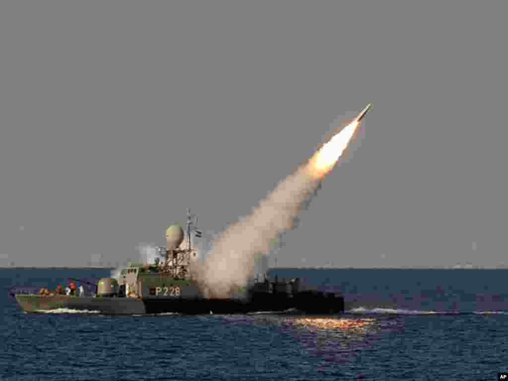 In this image made available by the Iranian Students News Agency, an Iranian navy vessel launches a missile during a drill at the Sea of Oman, on January 1, 2012. (AP)