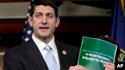 Congresman Paul Ryan holds copy of 2014 Budget Resolution March 12, 2013.