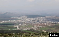 FILE - A general view shows the Kurdish city of Afrin, in Aleppo's countryside, March 18, 2015.