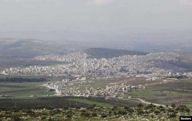 FILE - A general view shows the Kurdish city of Afrin, in Aleppo's countryside, March 18, 2015.