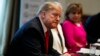 President Donald Trump listens during an event on human trafficking in the Cabinet Room of the White House, Feb. 1, 2019, in Washington. 