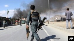 FILE - Afghan security forces respond to a suicide attack in Kabul, Afghanistan, March 1, 2017.