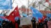 FILE - Several hundred Uighurs living in Turkey, carrying Turkish flags and flags of what ethnic Uighurs call East Turkestan, protest alleged oppression by the Chinese government to Muslim Uighurs in far-western Xinjiang province, in Ankara, Turkey, Feb. 5, 2018. 