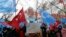 FILE - Several hundred Uighurs living in Turkey, carrying Turkish flags and flags of what ethnic Uighurs call East Turkestan, protest alleged oppression by the Chinese government to Muslim Uighurs in far-western Xinjiang province, in Ankara, Turkey, Feb. 5, 2018. 
