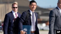 Acting-Secretary of Homeland Security Chad Wolf, center, arrives to join President Donald Trump at Andrews Air Force Base in Md., Aug. 18, 2020.