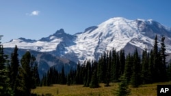 FILE - Mount Rainier is pictured Sept. 21, 2023, at Mount Rainier National Park, as seen from Sunrise, Washington. A U.S. Navy EA-18G Growler jet crashed east of Mount Rainier Tuesday in a remote, steep and heavily wooded area, killing both crew members on board.