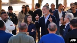 Spain's King Felipe VI and Queen Letizia visit the flood damaged town of Utiel, in the region of Valencia, eastern Spain, in the aftermath of catastrophic deadly floods, on November 19, 2024.