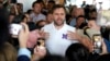 Republican vice presidential nominee Sen. JD Vance, R-Ohio, speaks with patrons at Sup Dogs restaurant during a campaign stop in Greenville, North Carolina, Sept. 14, 2024.