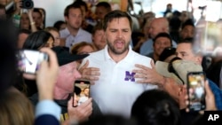 Republican vice presidential nominee Sen. JD Vance, R-Ohio, speaks with patrons at Sup Dogs restaurant during a campaign stop in Greenville, North Carolina, Sept. 14, 2024.