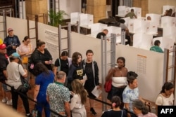 People stand in line at Honolulu Hale to cast their ballot to vote in this year’s general election in Honolulu, Hawaii, Nov. 5, 2024.