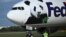 A FedEx cargo jet transporting two giant pandas from China lands at Dulles airport in Virginia, Oct. 15, 2024.
