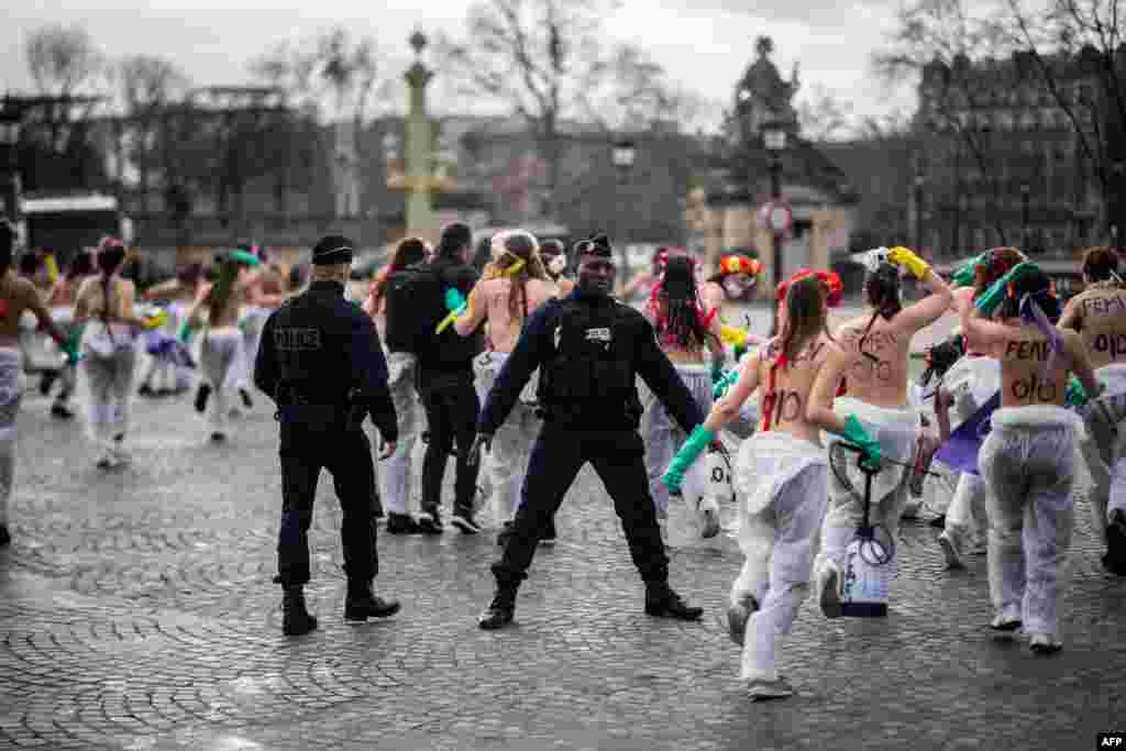 Femen activists demonstrate at place de la Concorde in Paris, to call for gender equality on the International Women's day.