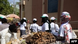 FILE - Members from the Consultation Group Of Political Actors (GCAP) campaign at the central market for the boycott of Chad's legislative, communal and provincial elections in N'Djamena on Dec. 16, 2024.