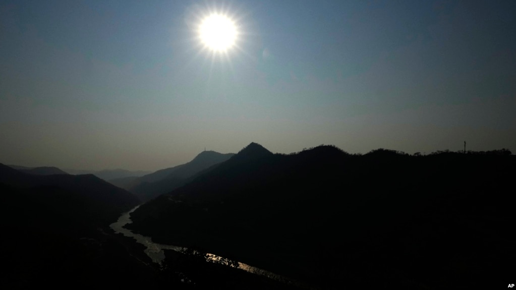 FILE - The sun rises near the Kariba Dam in Siavonga, Zambia, on Sept. 19, 2024.