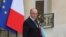 FILE - French Interior Minister Bernard Cazeneuve leaves the Elysee Palace following a weekly Cabinet meeting in Paris, May 2014.