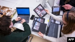 FILE - Students attend a class on media literacy at the Hiidenkiven Koulu school on November 19, 2024 in Helsinki, Finland.