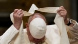 Pope Francis loses his scull cap during a meeting with diocesan community in the Basilica of St. John Lateran, in Rome, Oct. 25, 2024. 