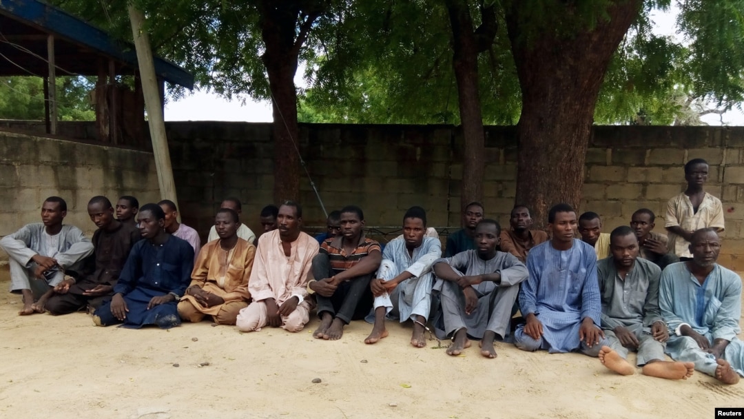 FILE - Suspected members of Islamist militant group Boko Haram are pictured after being arrested in Maiduguri, Nigeria, July 18, 2018.