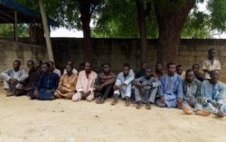 FILE - Suspected members of Islamist militant group Boko Haram are pictured after being arrested in Maiduguri, Nigeria, July 18, 2018.