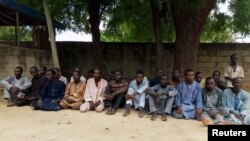FILE - Suspected members of Islamist militant group Boko Haram are pictured after being arrested in Maiduguri, Nigeria, July 18, 2018.