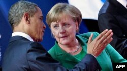 Prezident Obama Germaniya kansleri Angela Merkel bilan, Kann, Fransiya, 4-oktabr 2011