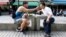 Lin Chinxuan, left, 29, feeds Austin Haung, 32, a dessert in Taipei, Taiwan, Nov. 11, 2018. Lin Chinxuan and Austin Haung are a couple and together they run Hiwow studio photographing LGBTQ couples, who they say mostly come from overseas.