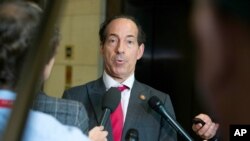 FILE - Democratic Congressman Jamie Raskin speaks with reporters at the Capitol in Washington, Oct. 26, 2019.