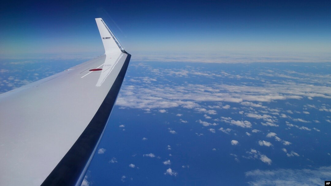 Japan Coast Guard's Gulfstream V aircraft flies in the search zone for debris from the missing Malaysia Airlines flight MH370, April 1, 2014 off Perth, Australia.