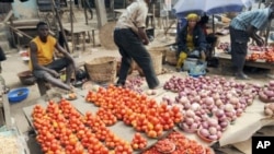 Vendors display their vegetables for sell but complain of low patronage because of hike in pump price that has affected cost of food stuff at Mile 12 market in Lagos, Nigeria. (File)