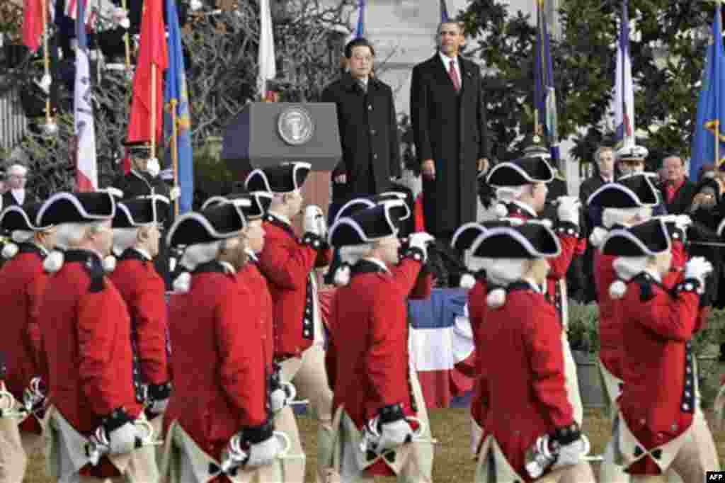 President Barack Obama welcomes China's President Hu Jintao for a state arrival ceremony at the White House in Washington, Wednesday, Jan. 19, 2011. (AP Photo/J. Scott Applewhite)