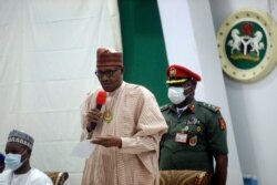 FILE - Nigeria's President Muhammadu Buhari speaks during a meeting with the freed schoolboys on Friday Dec. 18, 2020, in Katsina, Nigeria.