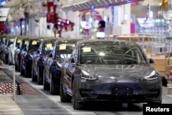 Tesla China-made Model 3 vehicles are seen during a delivery event at its factory in Shanghai, China, Jan. 7, 2020.