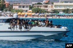 FILE - In this file picture mew migrants arrive on a Guardia di Finanza ship, in the harbour of Italian island of Lampedusa, on September 15, 2023.