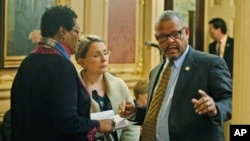 Del. Delores McQuinn, D-Richmond, left, speaks with State Sen. Siobhan Dunnavant, R-Henrico, center, and Del. Luke tori, D-Prince William, right during the House session at the Capitol, March 7 , 2020, in Richmond, Virginia. 