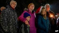 Supporters gather at a candlelight vigil Dec. 17, 2024, outside the Wisconsin Capitol in Madison, Wis., following a shooting at the Abundant Life Christian School on Dec. 16. 