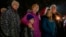 Supporters gather at a candlelight vigil Dec. 17, 2024, outside the Wisconsin Capitol in Madison, Wis., following a shooting at the Abundant Life Christian School on Dec. 16. 