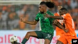 FILE — Nigeria's Alex Iwobi controls the ball during the final of the 2023 African Cup of Nations against Ivory Coast, at the Olympic Stadium of Ebimpe in Abidjan, Ivory Coast, on February 11, 2024.