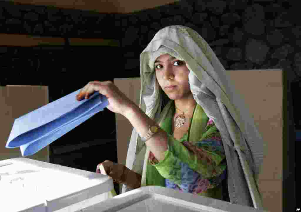 September 18, 2005 -- Afghanistan holds its first parliamentary elections, choosing 249 legislators and delegates to 34 provincial councils including, for the first time in Afghanistan, women. Nearly 600 women are among the six thousand candidates. The el