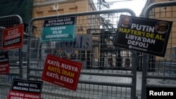 Placards are attached on security barriers outside the Russian Consulate following a protest against the killing of Turkish soldiers in Syria's Idlib region, in Istanbul, Turkey, Feb. 29, 2020.