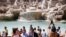 People gather in front of the Trevi fountain in Rome, June 28, 2021. 
