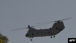 A US military helicopter is pictured flying near the US Embassy in Kabul, Aug. 15, 2021.