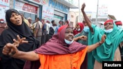 Somali women react at a protest against the African Union Mission in Somalia outside the Erdogan Hospital following the killing of civilians during a gunfight between AMISOM and al-Shabab fighters in the Lower Shabelle region, in Mogadishu, Aug. 12, 2021.
